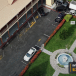 Aerial view of the High Court complex and court administration parking area in Georgetown, with the Invest Guyana Explains masthead.