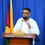 President Irfaan Ali speaking at a podium