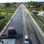Aerial view of paving work on the Palmyra–Moleson Creek road project