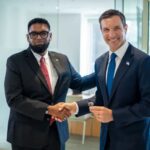 President Irfaan Ali and EXIM Chairman John Jovanovic shake hands at a meeting in New York on 21 September 2026.