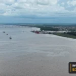 Drone view of the river, vessels and waterfront from Invest Guyana’s original footage.