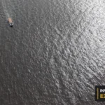 Drone view of the river, vessels and waterfront from Invest Guyana’s original footage.