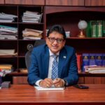 Attorney General and Minister of Legal Affairs Anil Nandlall seated at his desk.