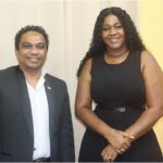 Two government representatives pictured together in the official Suriname aquaculture announcement.