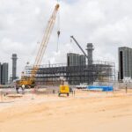 Construction equipment and turbine structures at the Wales Gas-to-Energy project site.