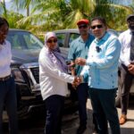 Agriculture Minister Zulfikar Mustapha hands over vehicles to NAREI in Guyana.