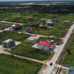 Aerial view of reinforced concrete road works in the Cummings Lodge Housing Scheme in Region Four